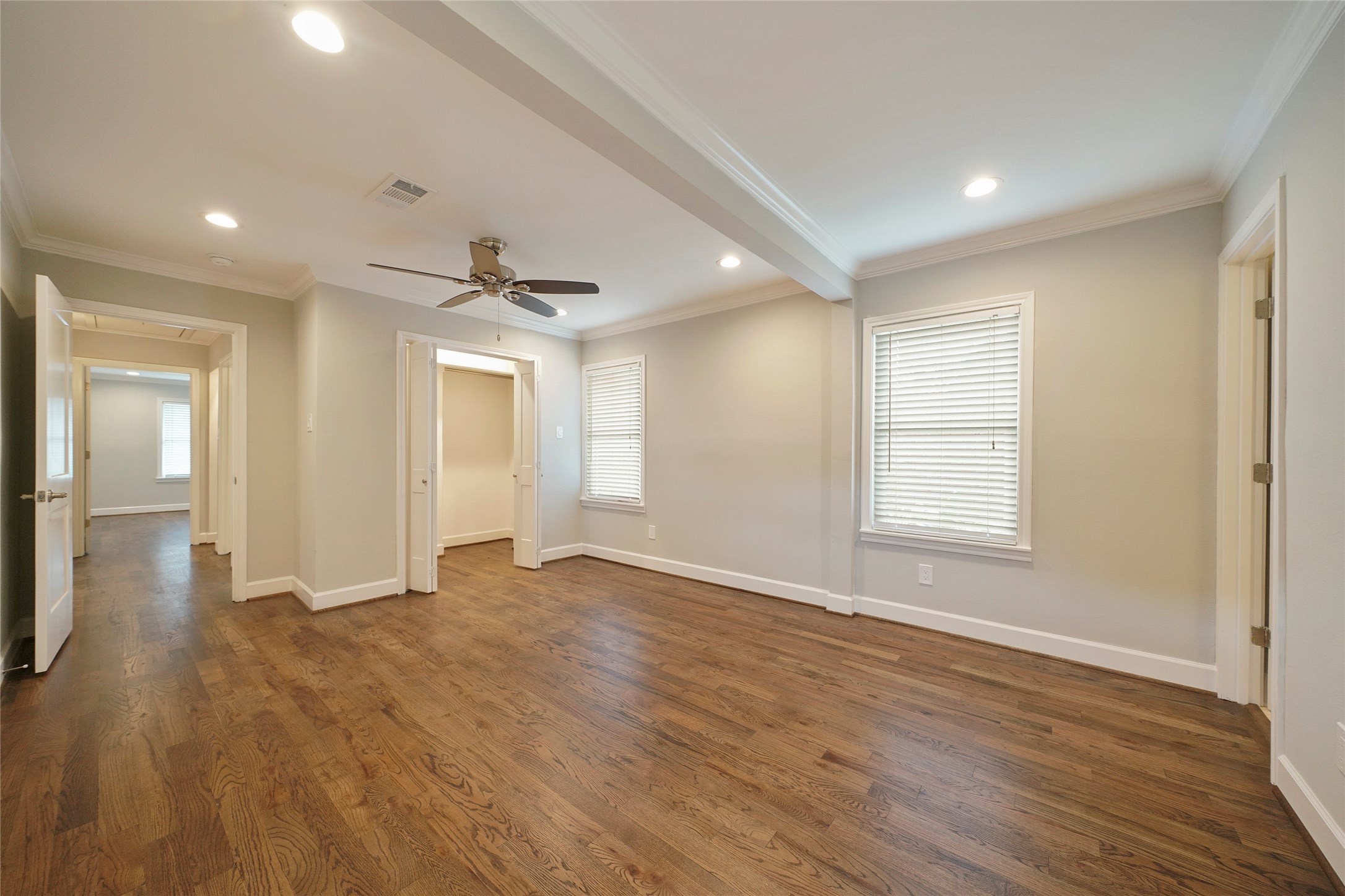 1229 Timbergrove Lane Houston, TX 77008 - Photo 15 of 30 a view of an empty room with wooden floor and a window