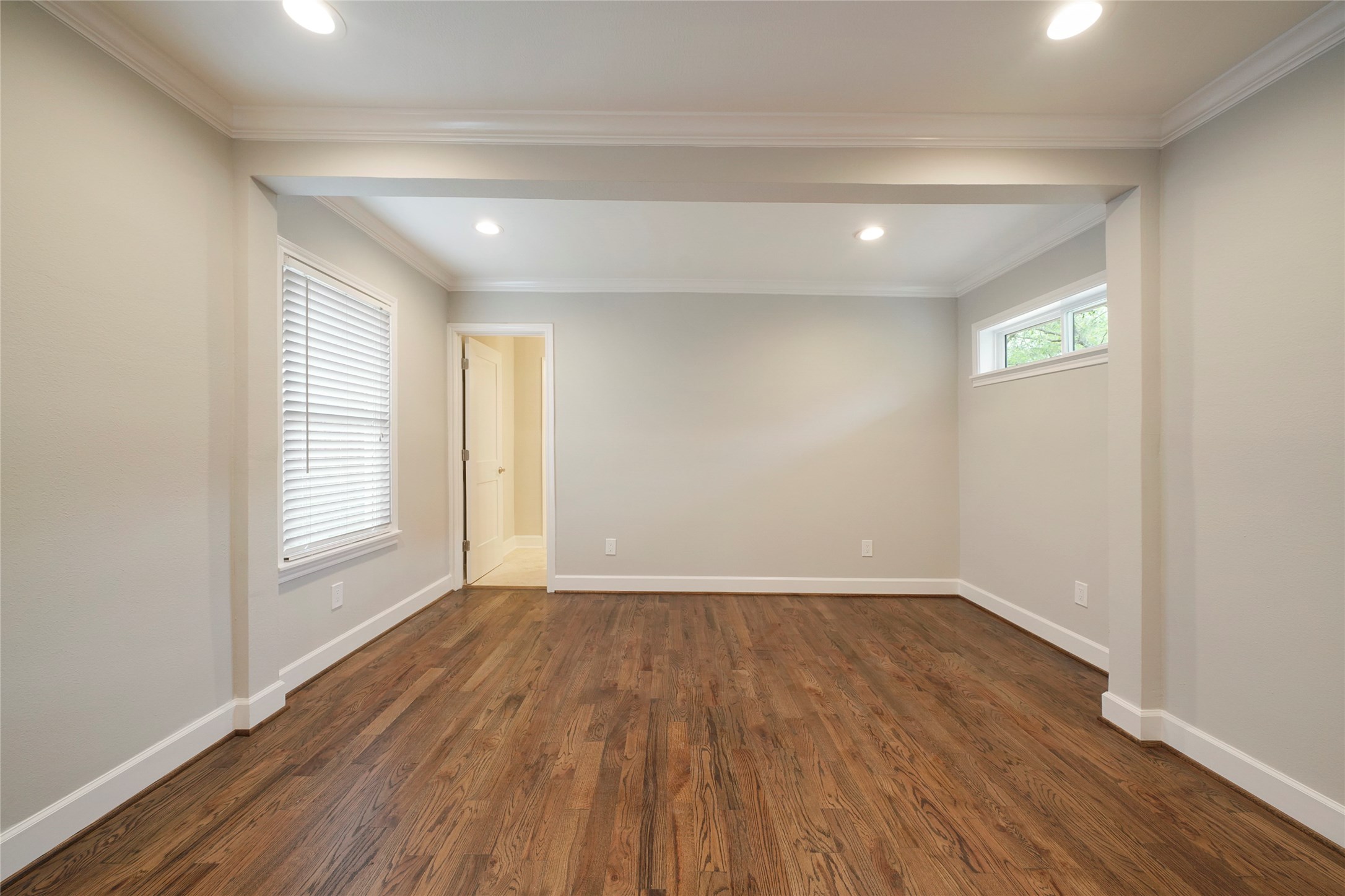 1229 Timbergrove Lane Houston, TX 77008 - Photo 16 of 30 a view of an empty room with wooden floor and a window