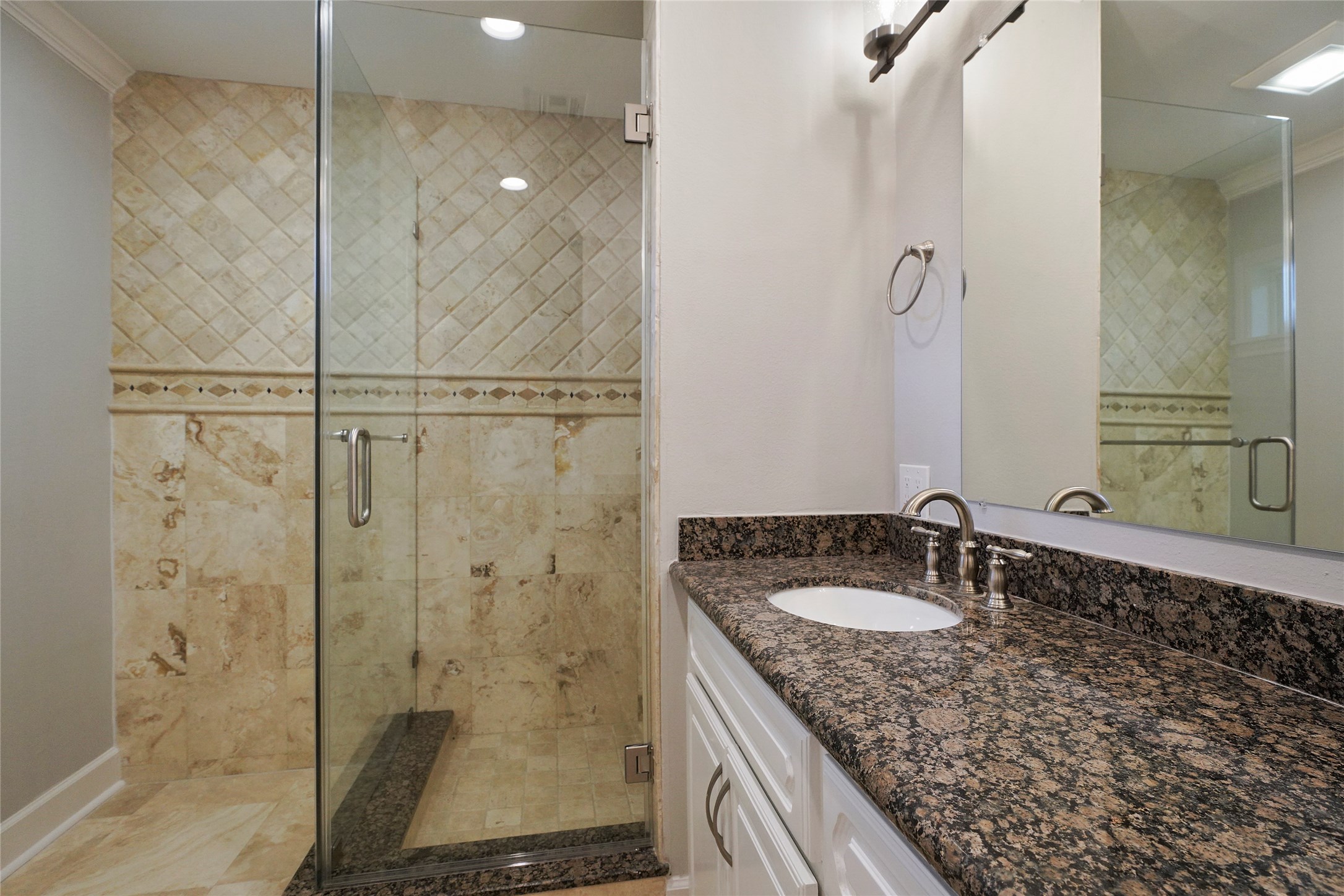 1229 Timbergrove Lane Houston, TX 77008 - Photo 19 of 30 a bathroom with a granite countertop sink a mirror and shower
