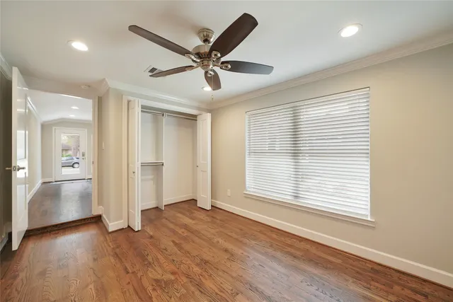 a view of garden with wooden fence