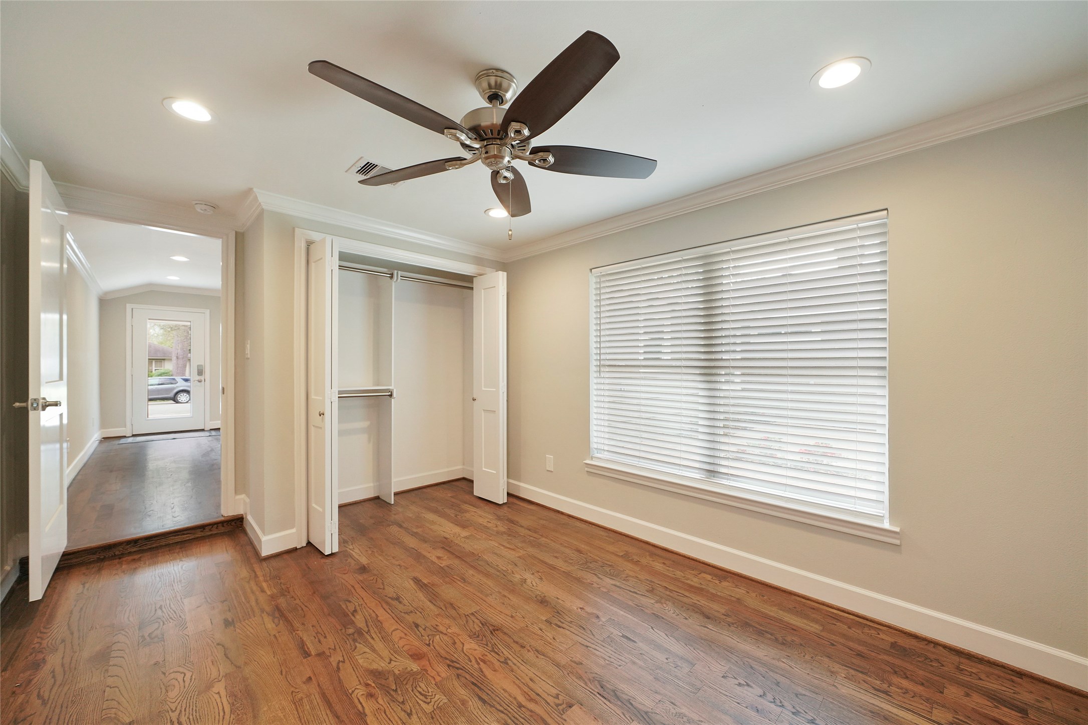 1229 Timbergrove Lane Houston, TX 77008 - Photo 25 of 30 a view of an empty room with wooden floor and a window