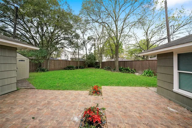 a view of a backyard with a small cabin