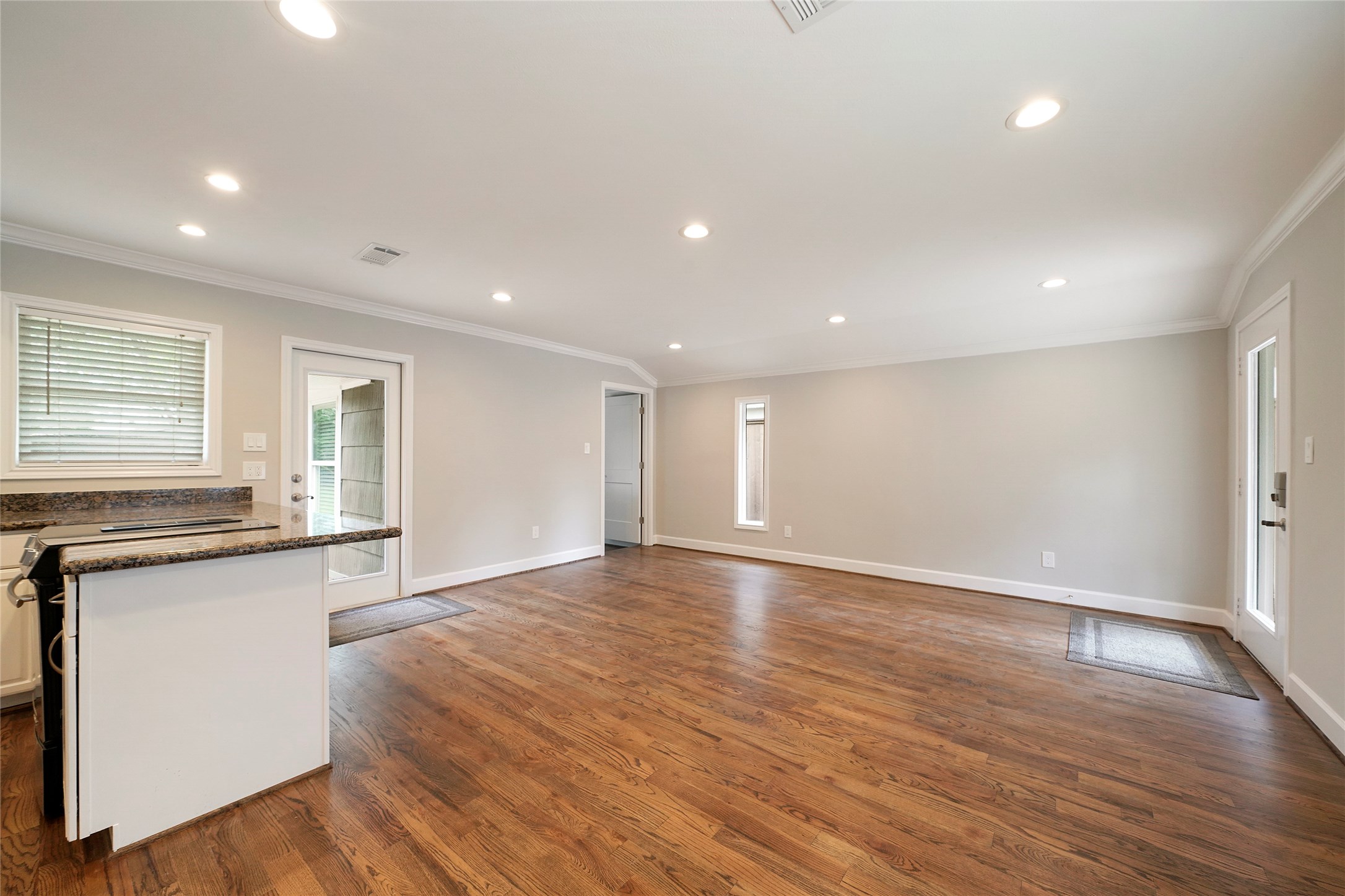 1229 Timbergrove Lane Houston, TX 77008 - Photo 4 of 30 an empty room with wooden floor and windows