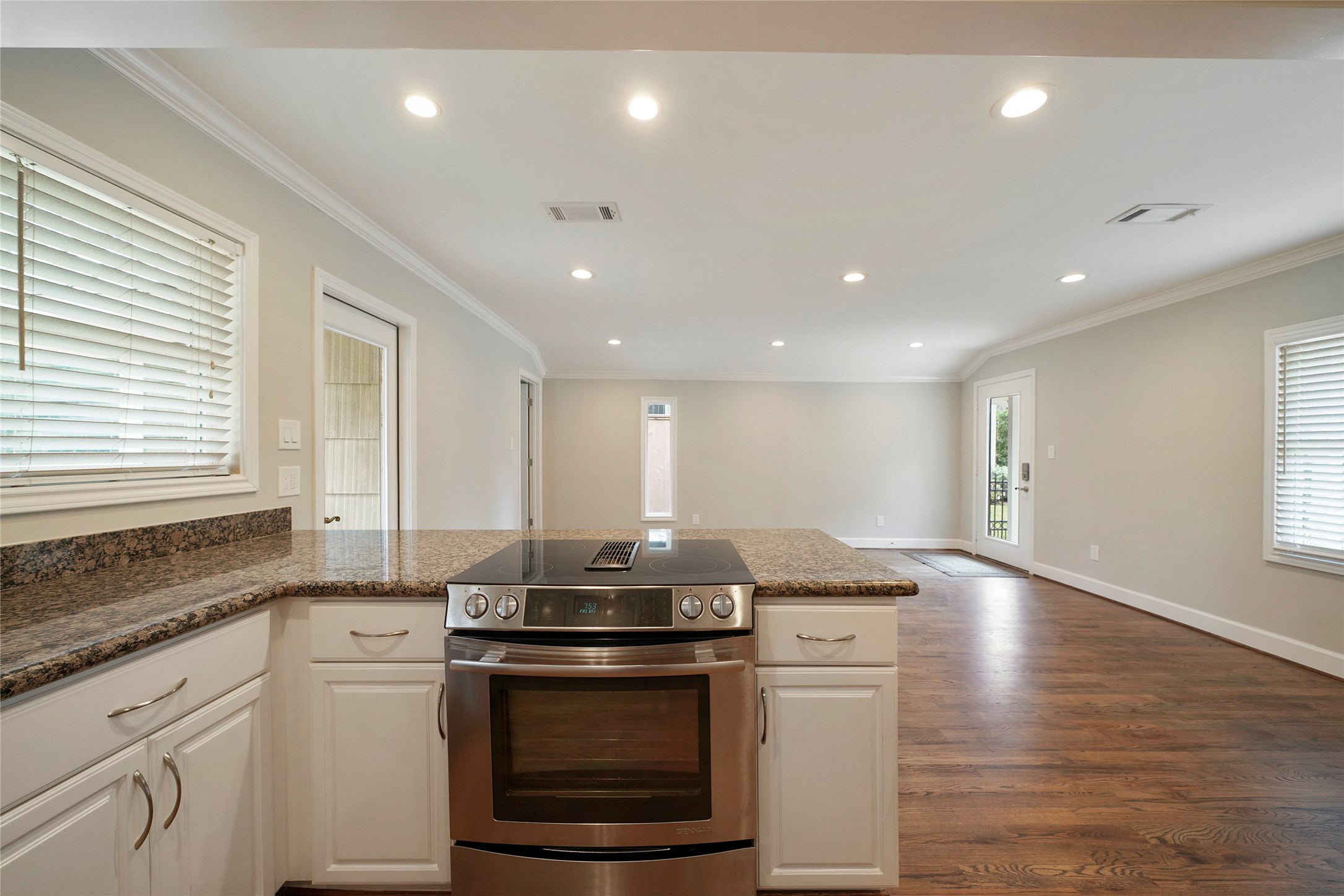 1229 Timbergrove Lane Houston, TX 77008 - Photo 10 of 30 a kitchen with stainless steel appliances granite countertop a stove a sink and a refrigerator