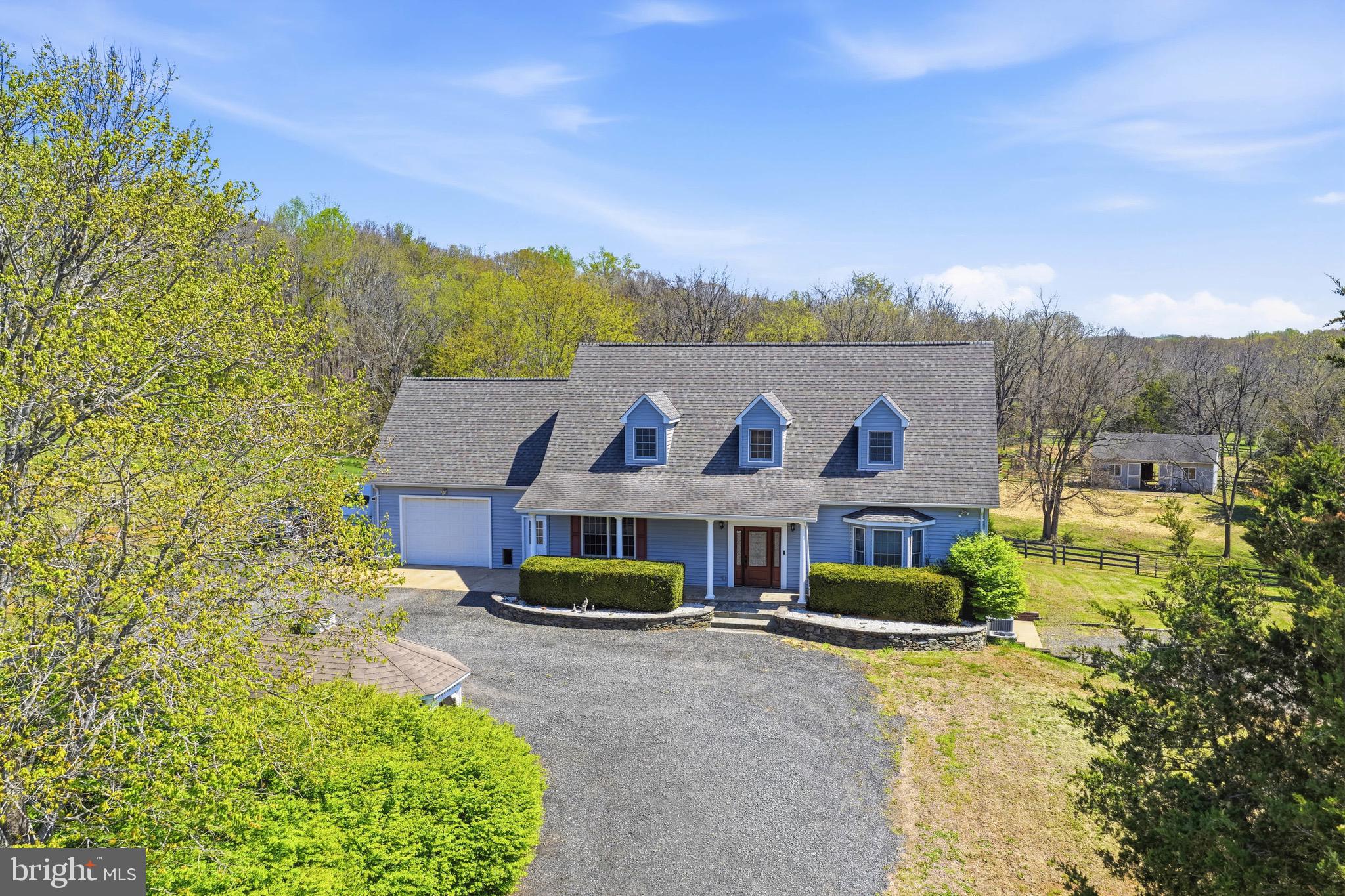 9571 Foxville Road Warrenton, VA 20186 - Photo 11 of 20 a view of house with outdoor space and sitting area