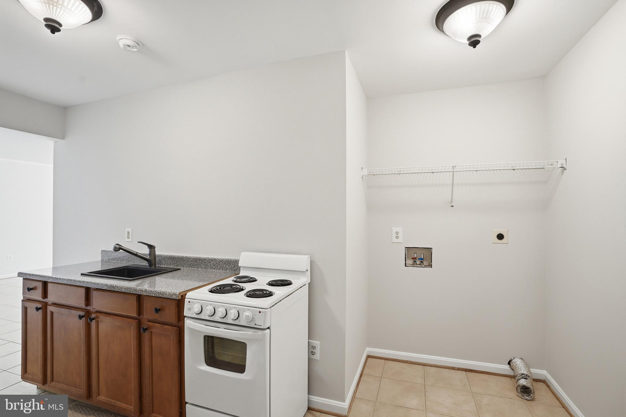 9571 Foxville Road Warrenton, VA 20186 - Photo 43 of 66 Lower Level Kitchenette and Laundry Hookup