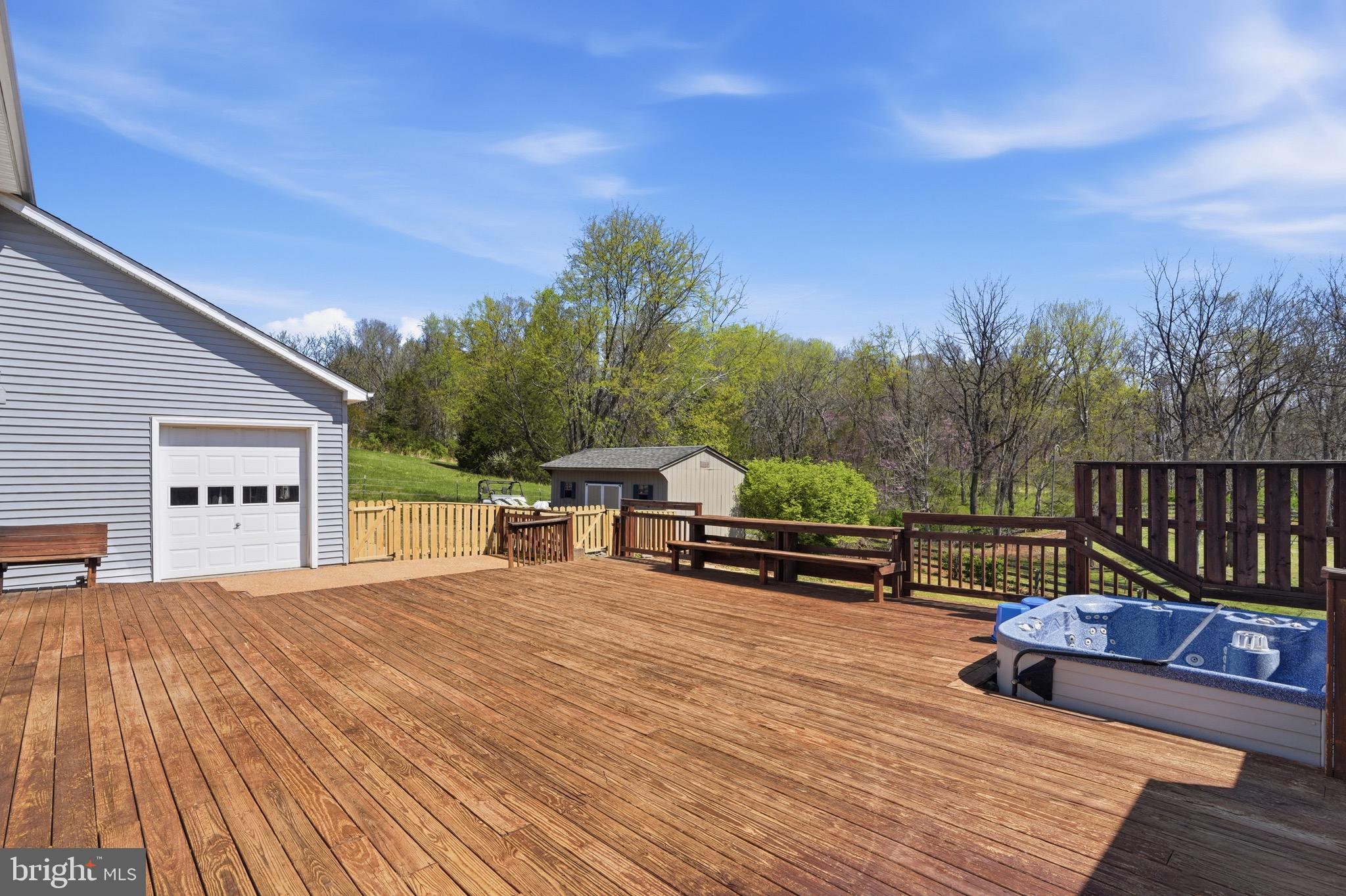 9571 Foxville Road Warrenton, VA 20186 - Photo 9 of 20 a view of a terrace with a bench