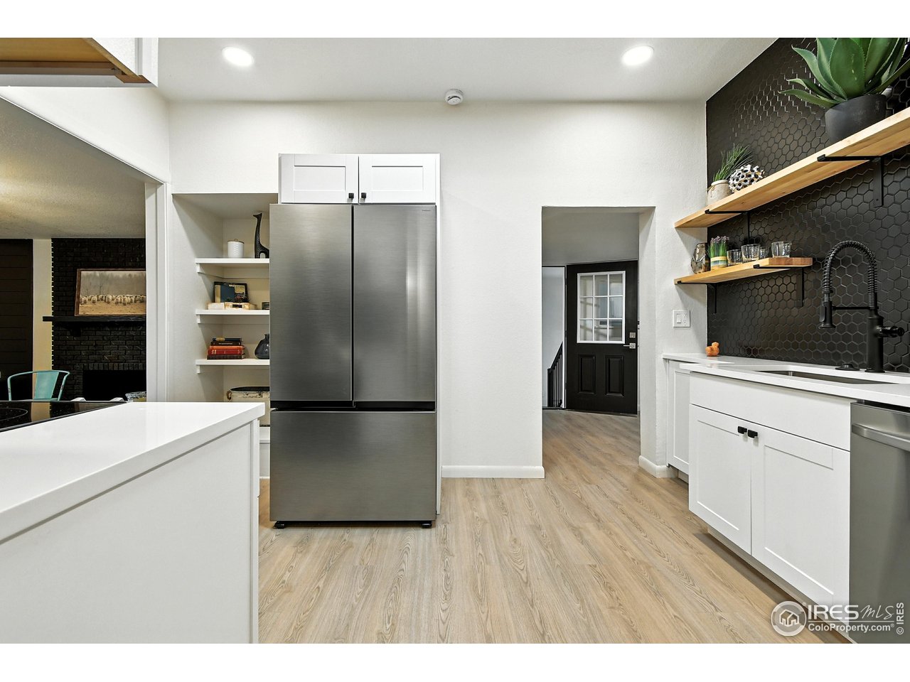 24149 County Road 70 Eaton, CO 80615 - Photo 12 of 40 a kitchen with stainless steel appliances a refrigerator microwave and sink