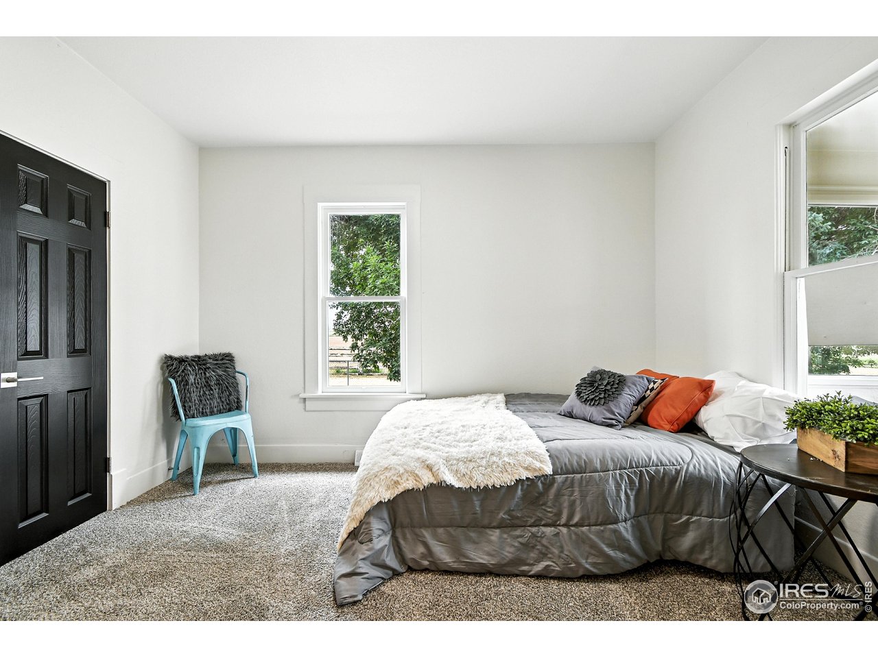 24149 County Road 70 Eaton, CO 80615 - Photo 19 of 40 a bedroom with a bed and furniture