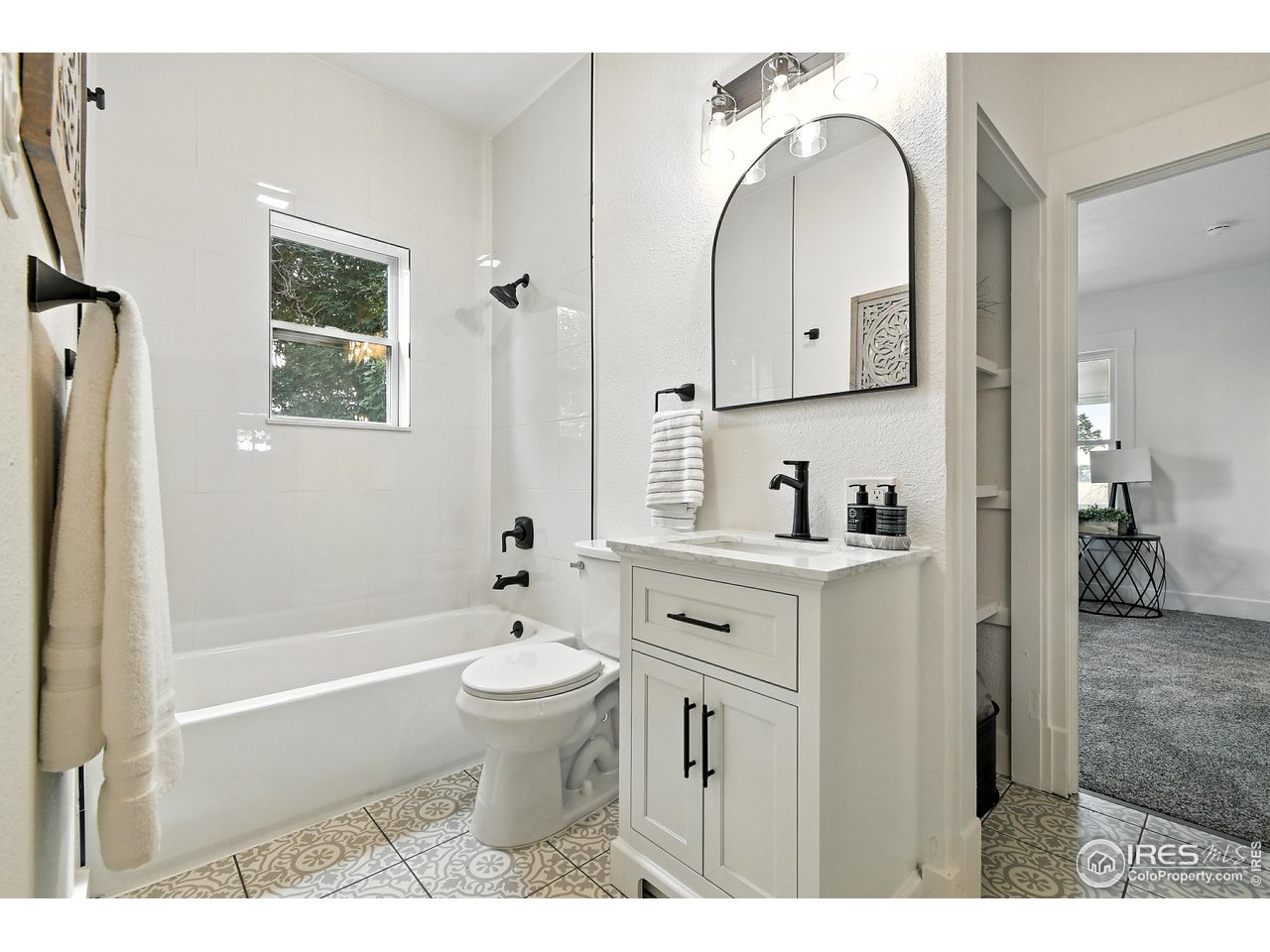24149 County Road 70 Eaton, CO 80615 - Photo 20 of 40 a bathroom with a sink a toilet and shower