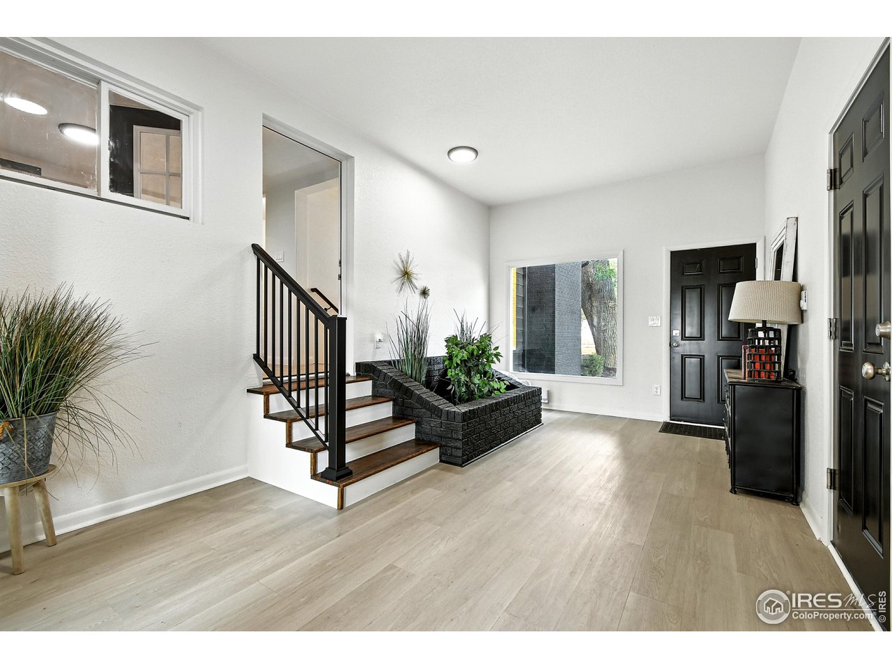 24149 County Road 70 Eaton, CO 80615 - Photo 24 of 40 a living room with furniture and a wooden floor