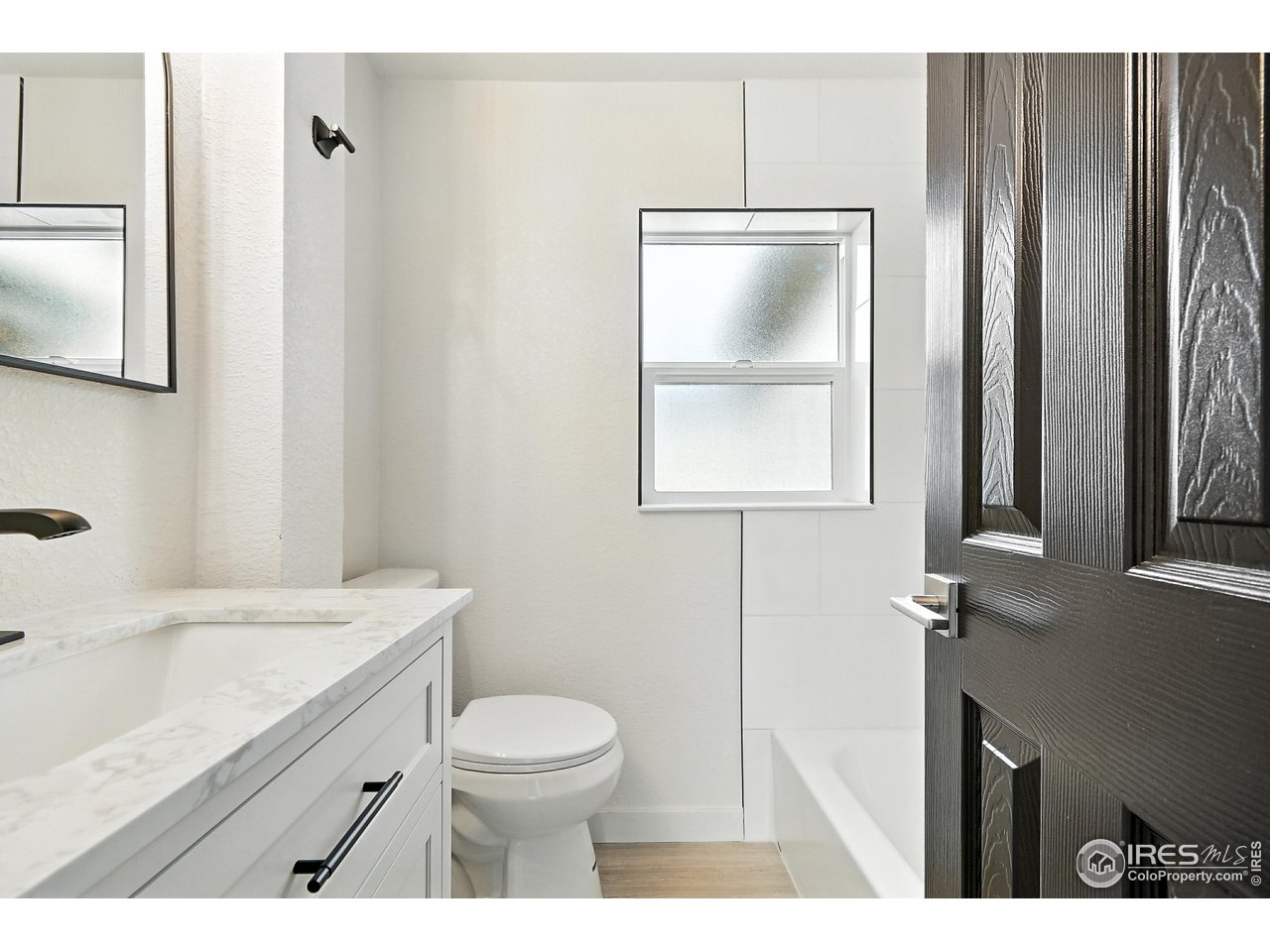 24149 County Road 70 Eaton, CO 80615 - Photo 37 of 40 a bathroom with a sink a toilet and mirror