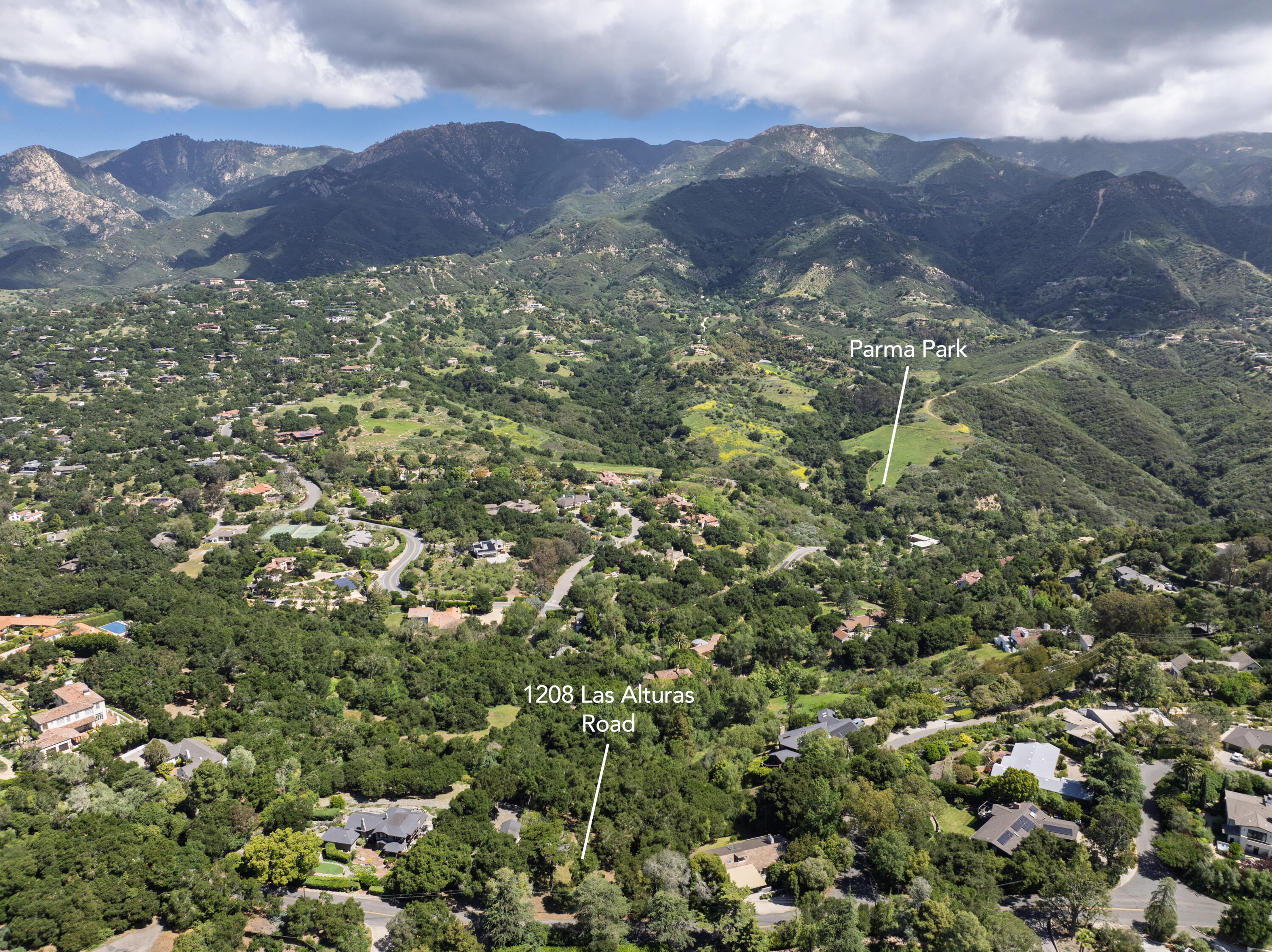 1208 Las Alturas Road Santa Barbara, CA 93103 - Photo 8 of 8 a view of a houses with a lush green hillside