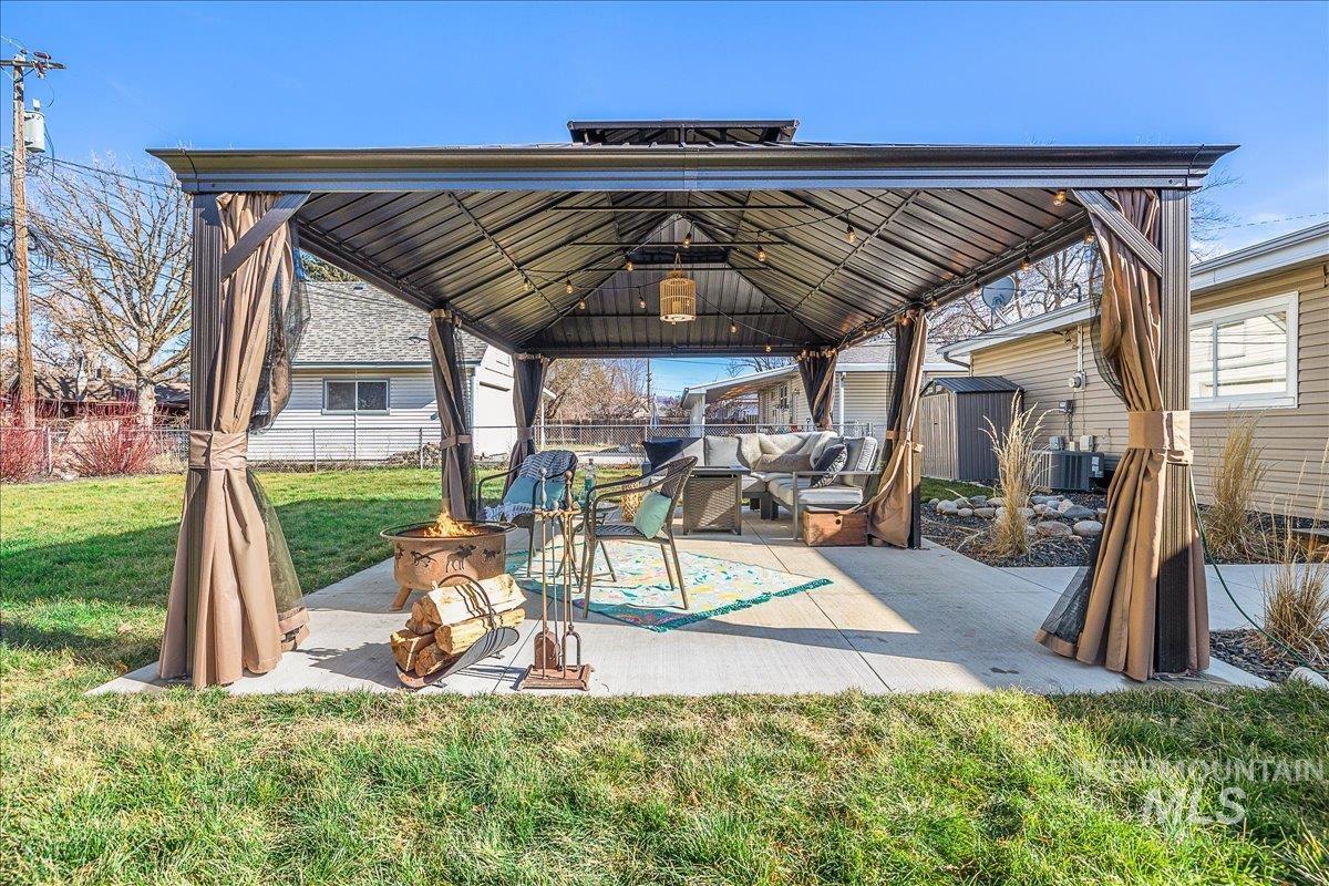 1910 Lemhi Street Boise, ID 83705 - Photo 11 of 41 Fenced backyard featuring a gazebo, an outdoor hangout area, and a patio area