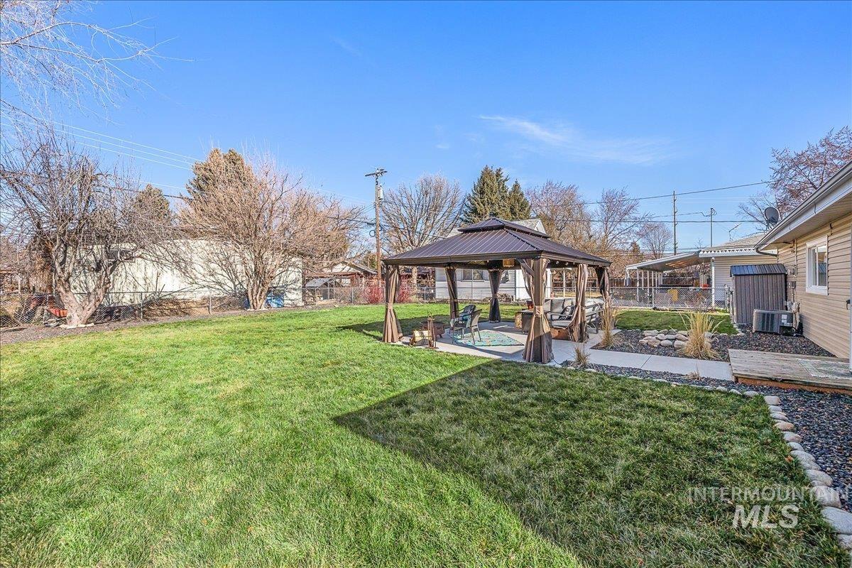 1910 Lemhi Street Boise, ID 83705 - Photo 12 of 41 Fenced backyard featuring a gazebo and a patio