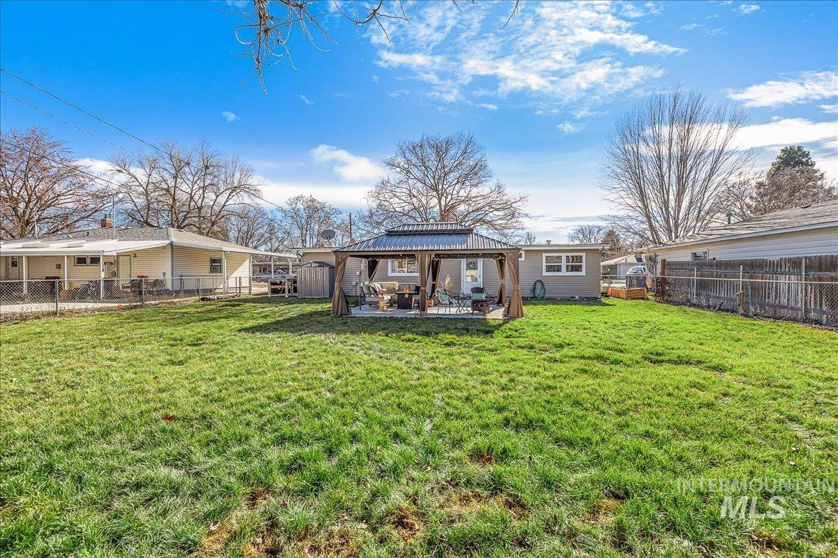 1910 Lemhi Street Boise, ID 83705 - Photo 14 of 41 Back of house featuring a gazebo, a fenced backyard, and a patio area