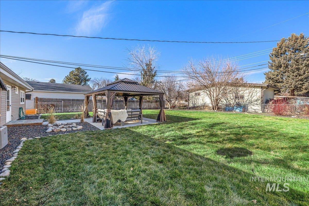 1910 Lemhi Street Boise, ID 83705 - Photo 16 of 41 Fenced backyard with a gazebo and a patio area