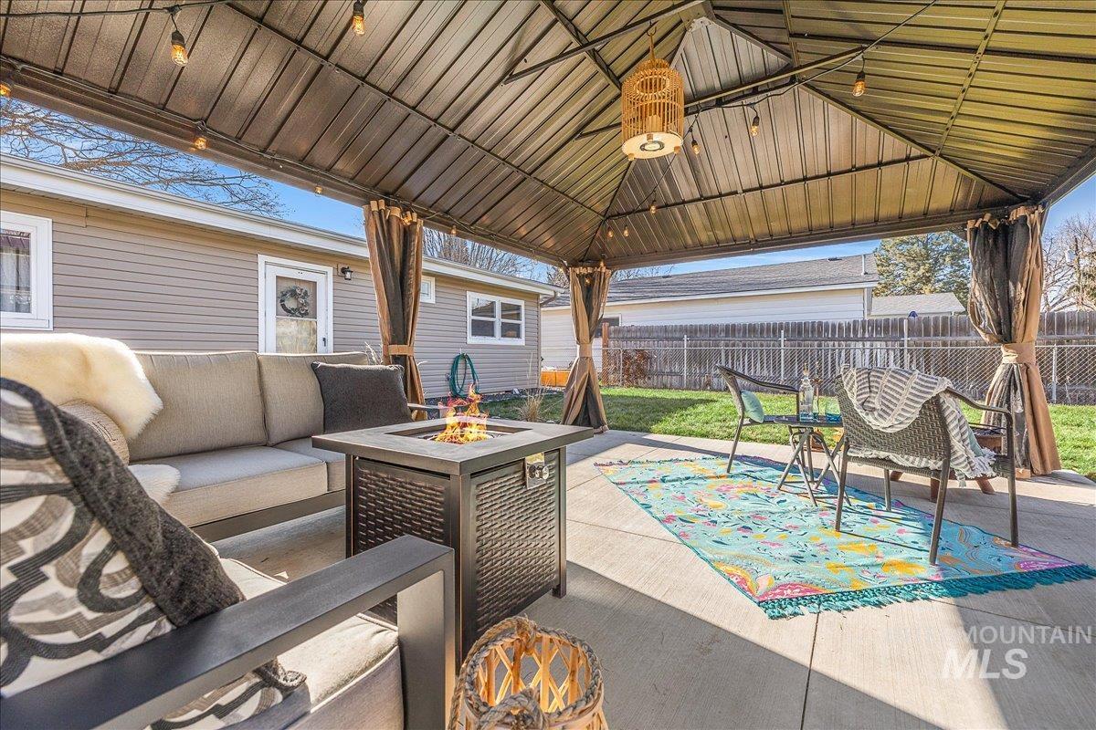 1910 Lemhi Street Boise, ID 83705 - Photo 18 of 41 View of patio / terrace featuring an outdoor living space with a fire pit and a gazebo