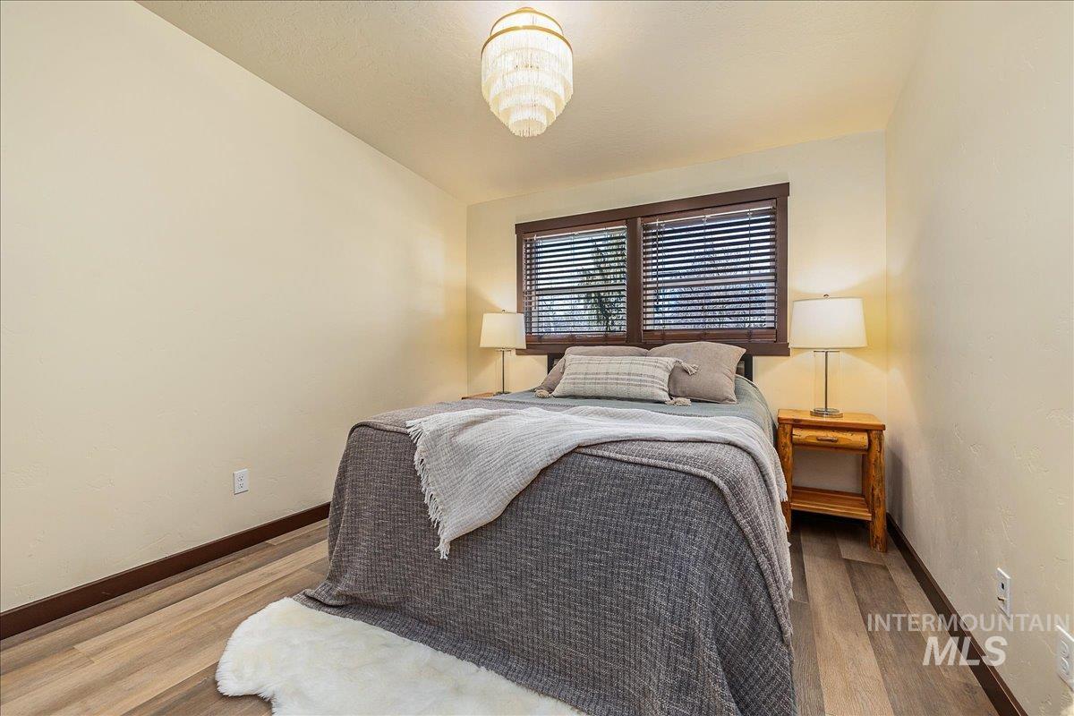 1910 Lemhi Street Boise, ID 83705 - Photo 35 of 41 Bedroom with baseboards and wood finished floors