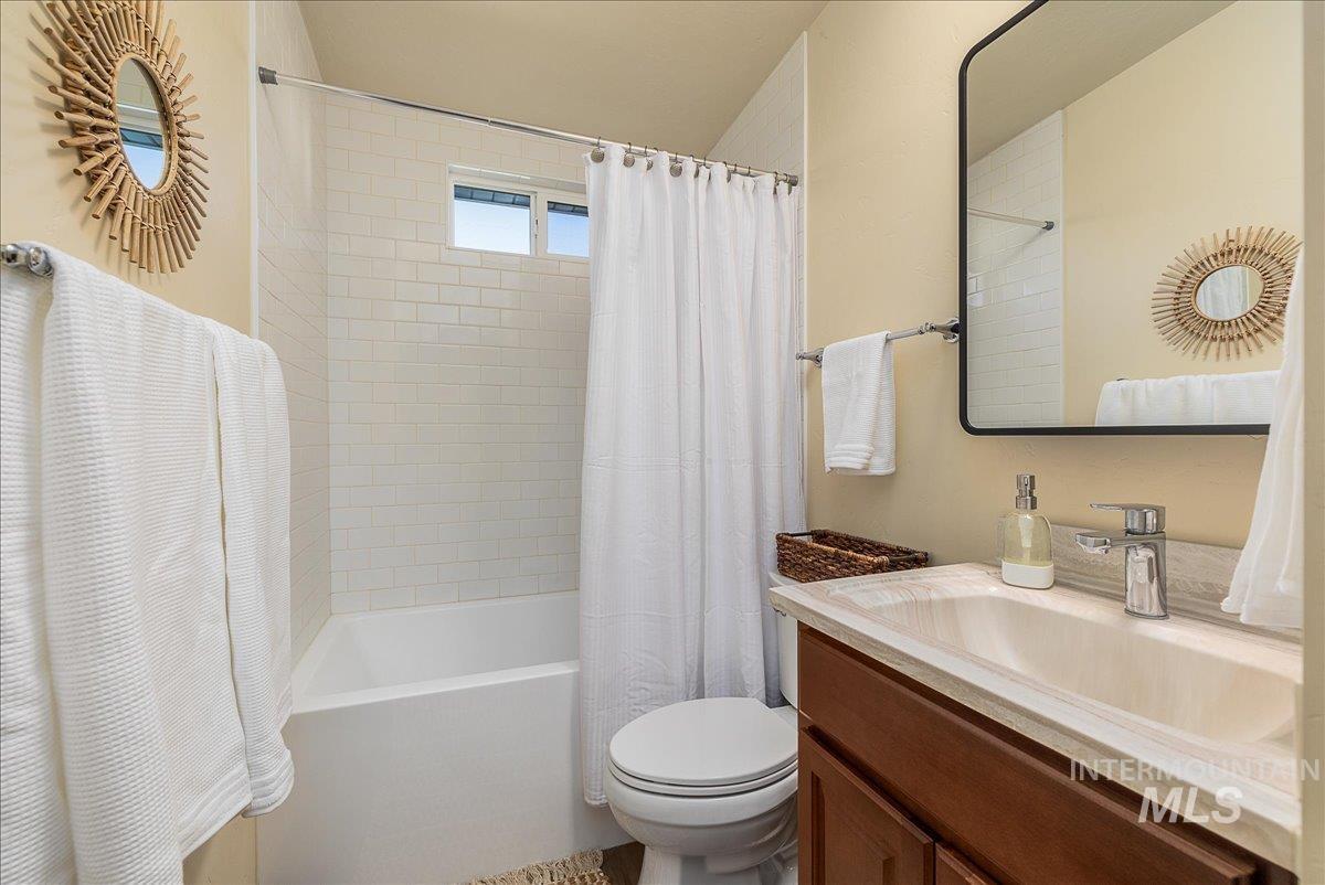 1910 Lemhi Street Boise, ID 83705 - Photo 36 of 41 Full bathroom featuring shower / tub combo with curtain and vanity