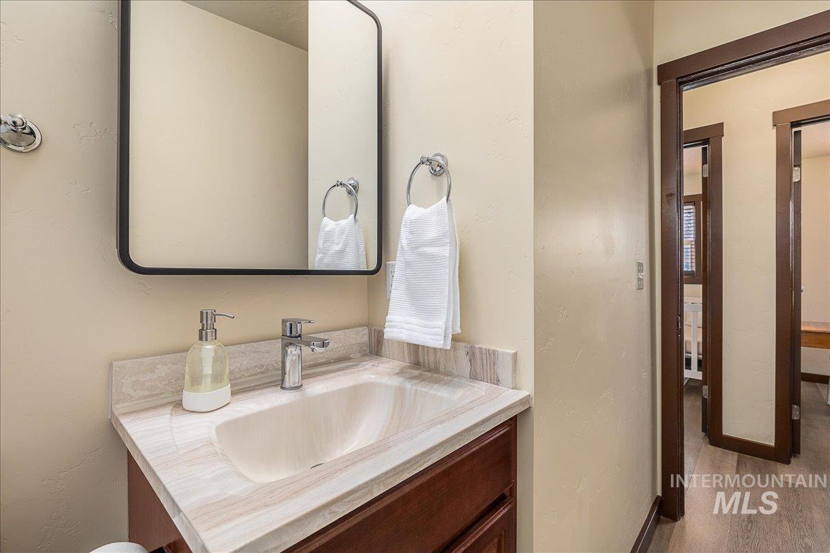 1910 Lemhi Street Boise, ID 83705 - Photo 37 of 41 Half bathroom with vanity and a textured wall
