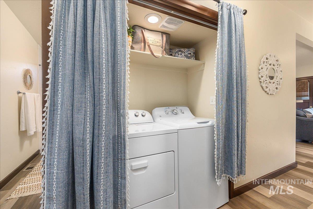 1910 Lemhi Street Boise, ID 83705 - Photo 38 of 41 Laundry area with wood finished floors and washer and dryer