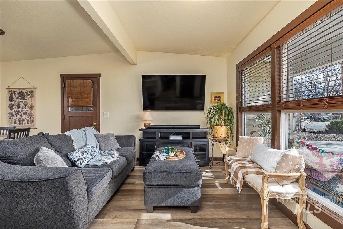 1910 Lemhi Street Boise, ID 83705 - Photo 39 of 41 Living area with wood finished floors and vaulted ceiling with beams