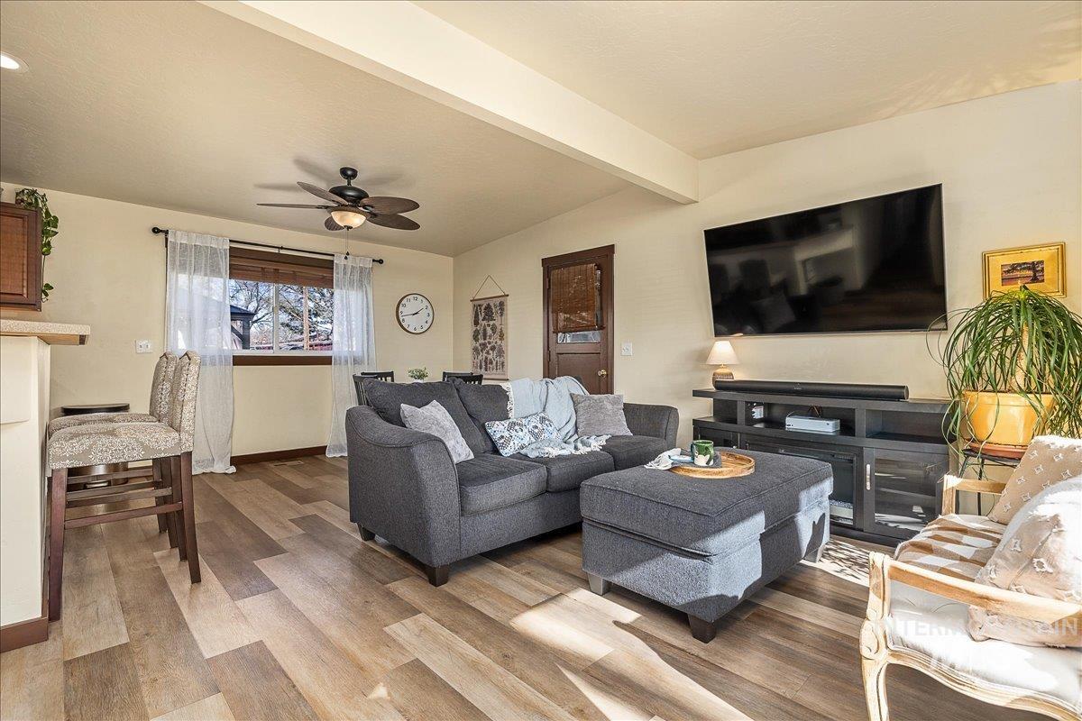1910 Lemhi Street Boise, ID 83705 - Photo 4 of 41 Living room featuring a ceiling fan, wood finished floors, and beamed ceiling