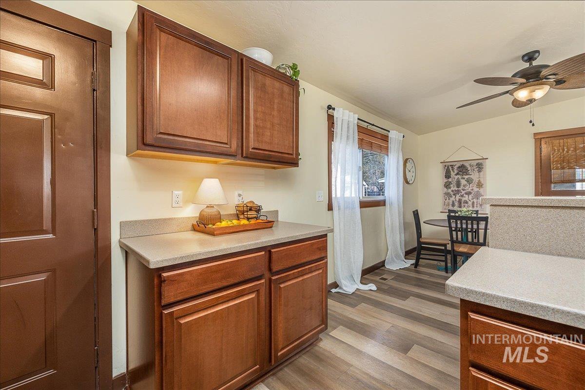 1910 Lemhi Street Boise, ID 83705 - Photo 9 of 41 Kitchen featuring a ceiling fan, wood finish cabinets, and dark wood-type flooring