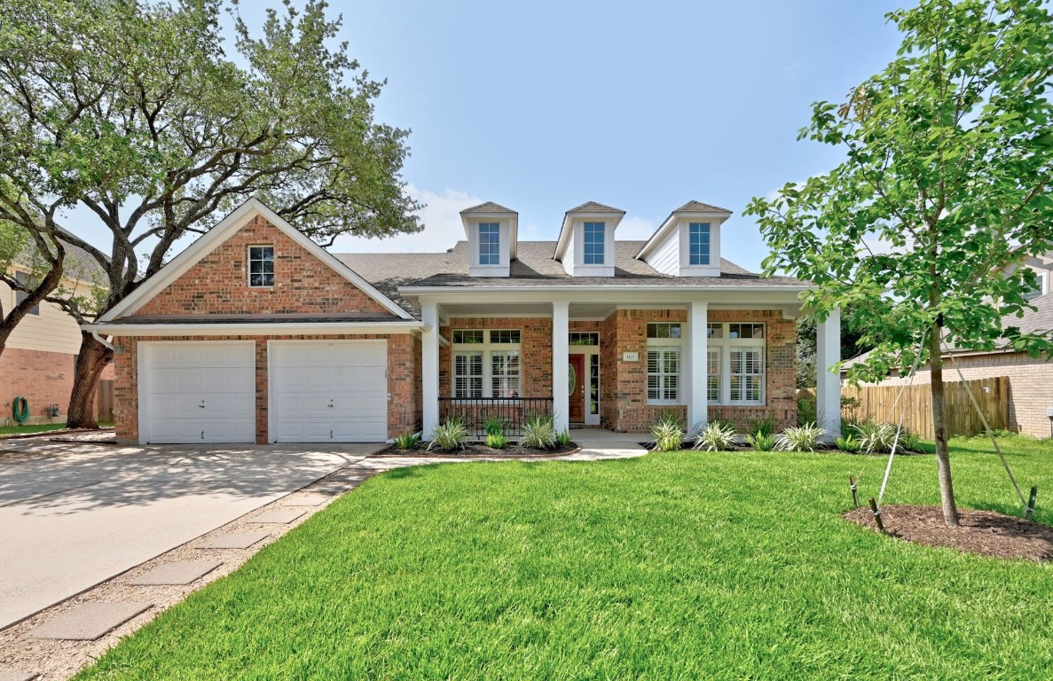 Beautiful 1-story with fresh landscaping including new grass, flowerbeds w/ mulch, and pavers + gravel front walk, newly planted Monterrey Oak tree.