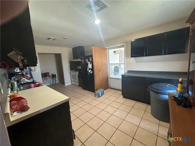 a bed room with a bed window and a lamp