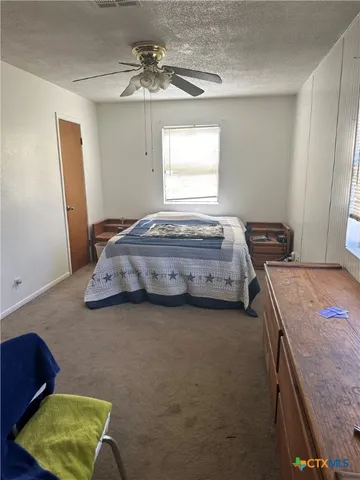 a view of a backyard of the house