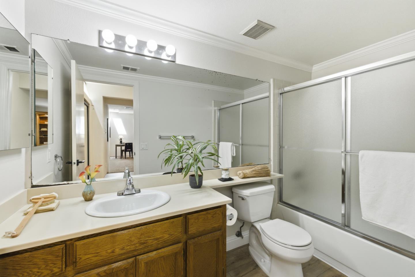 1669 Geary Road Walnut Creek, CA 94597 - Photo 26 of 39 a bathroom with a sink toilet and shower