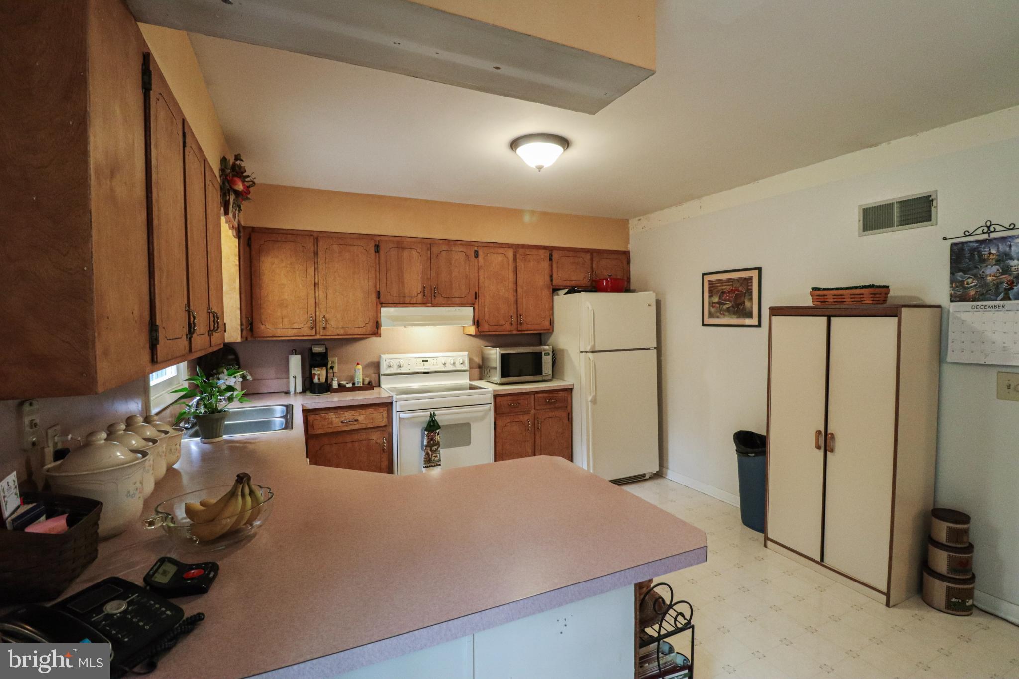 92 Newman Road Orrtanna, PA 17353 - Photo 15 of 42 Cozy kitchen with warm wooden accents.