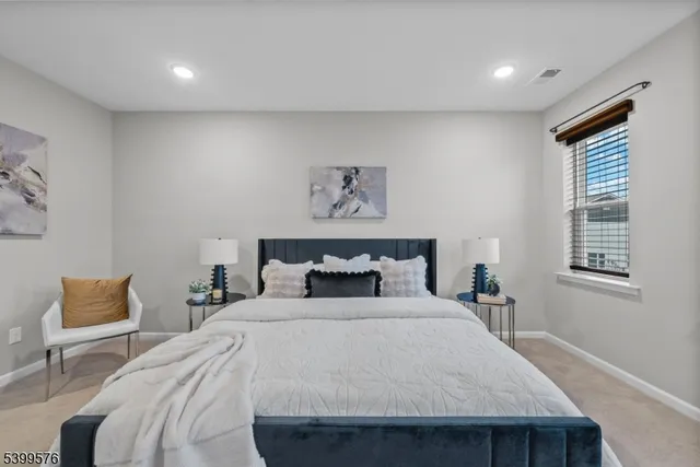 a bedroom with a bed and a couch