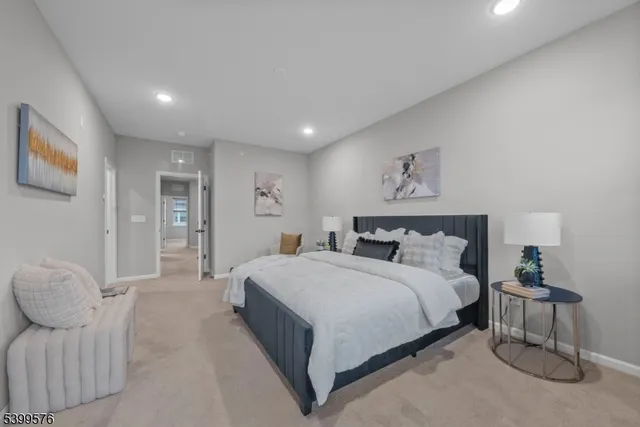 a spacious bedroom with a bed and a couch