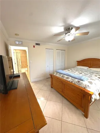 a room with a bed and a table in it