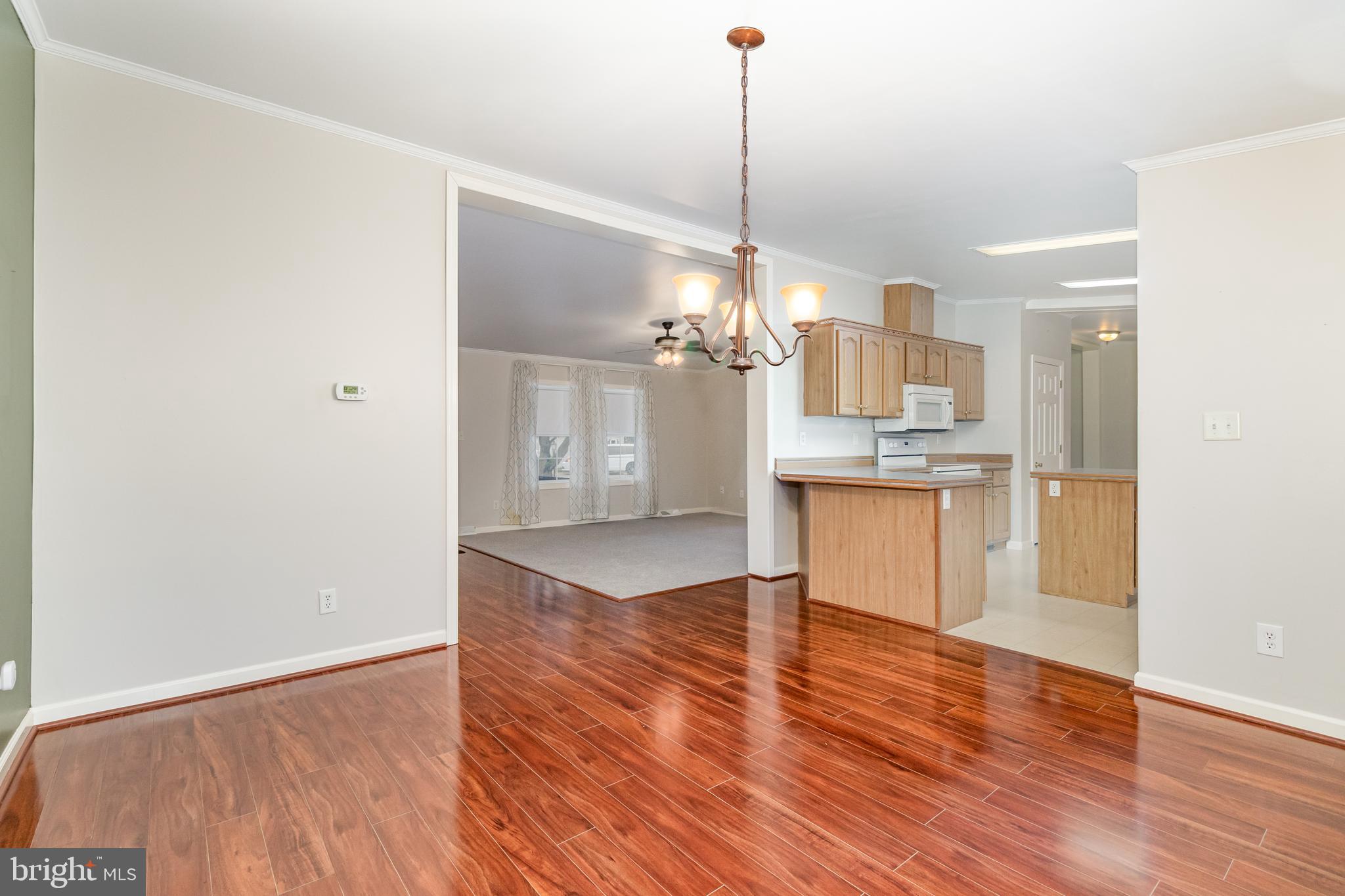 268 David Circle York, PA 17406 - Photo 11 of 26 a view of a kitchen with a refrigerator sink and wooden floor