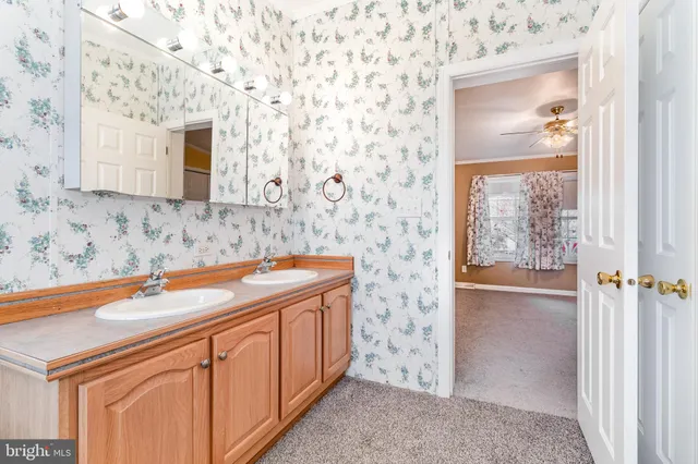 a bathroom with a sink a vanity and a mirror