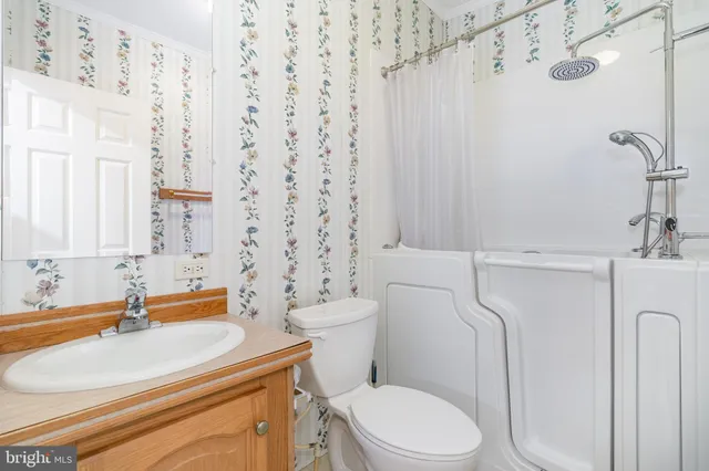 a bathroom with a sink and mirror