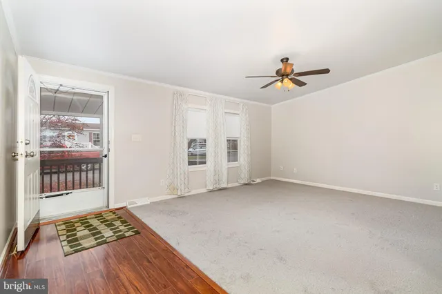 a view of a roof deck with wooden fence