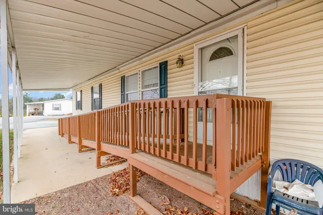 a view of a patio with wooden fence