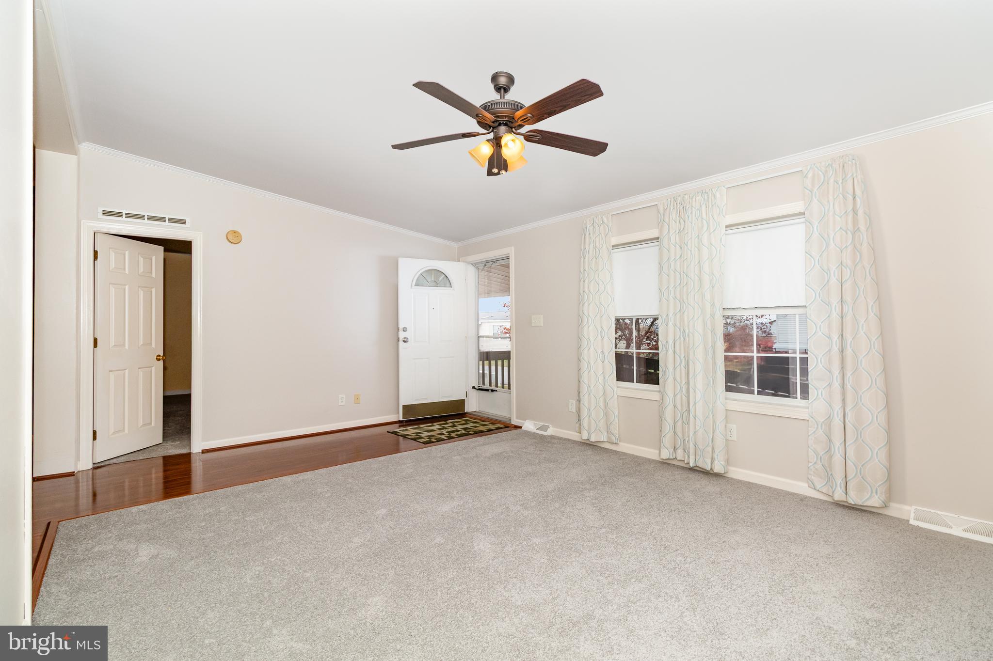 268 David Circle York, PA 17406 - Photo 7 of 26 a view of a livingroom with a ceiling fan and window
