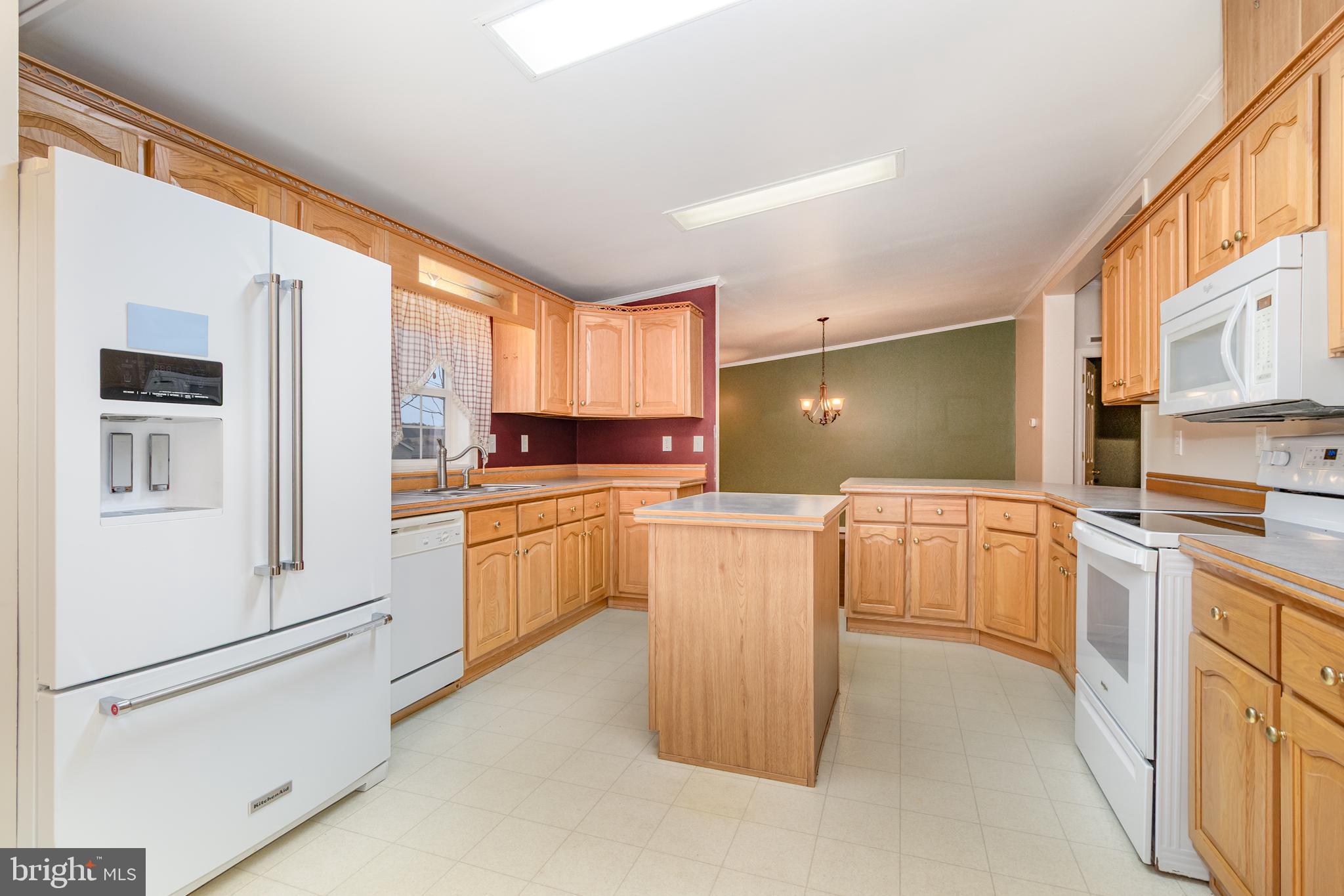 268 David Circle York, PA 17406 - Photo 9 of 26 a kitchen with a refrigerator and white cabinets
