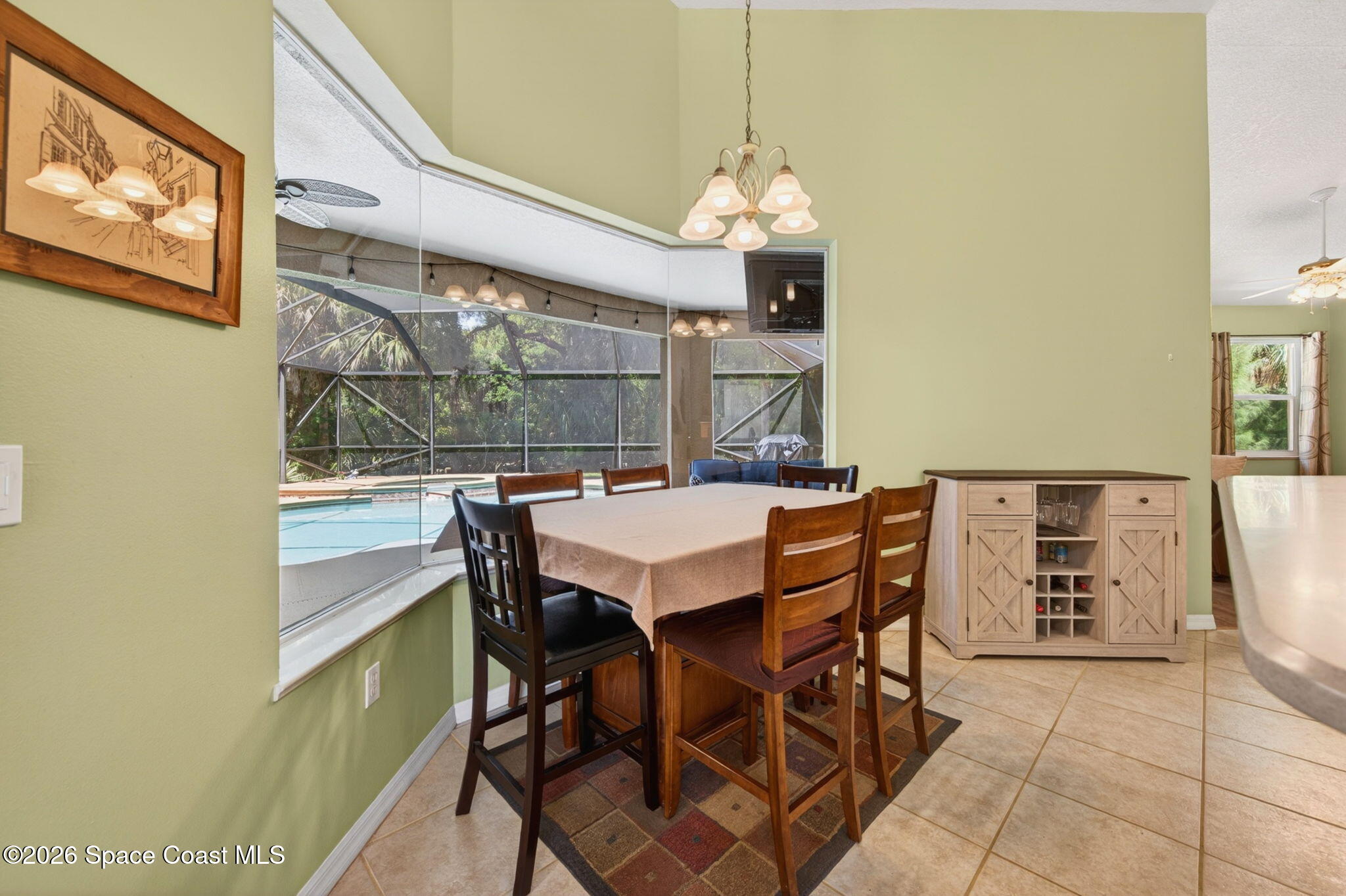 440 Mohawk Trail Merritt Island, FL 32953 - Photo 14 of 86 a view of a dining room with furniture and chandelier
