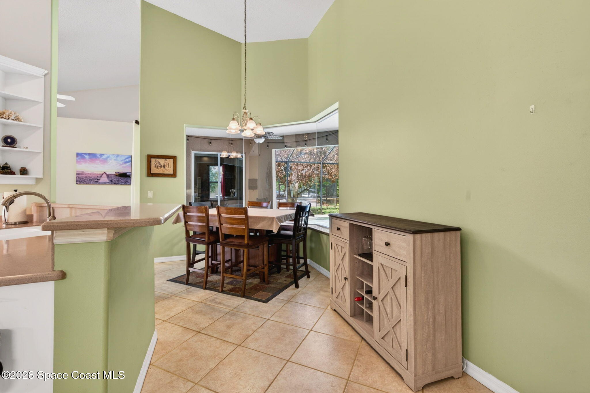 440 Mohawk Trail Merritt Island, FL 32953 - Photo 15 of 86 a view of a dining room with furniture and chandelier