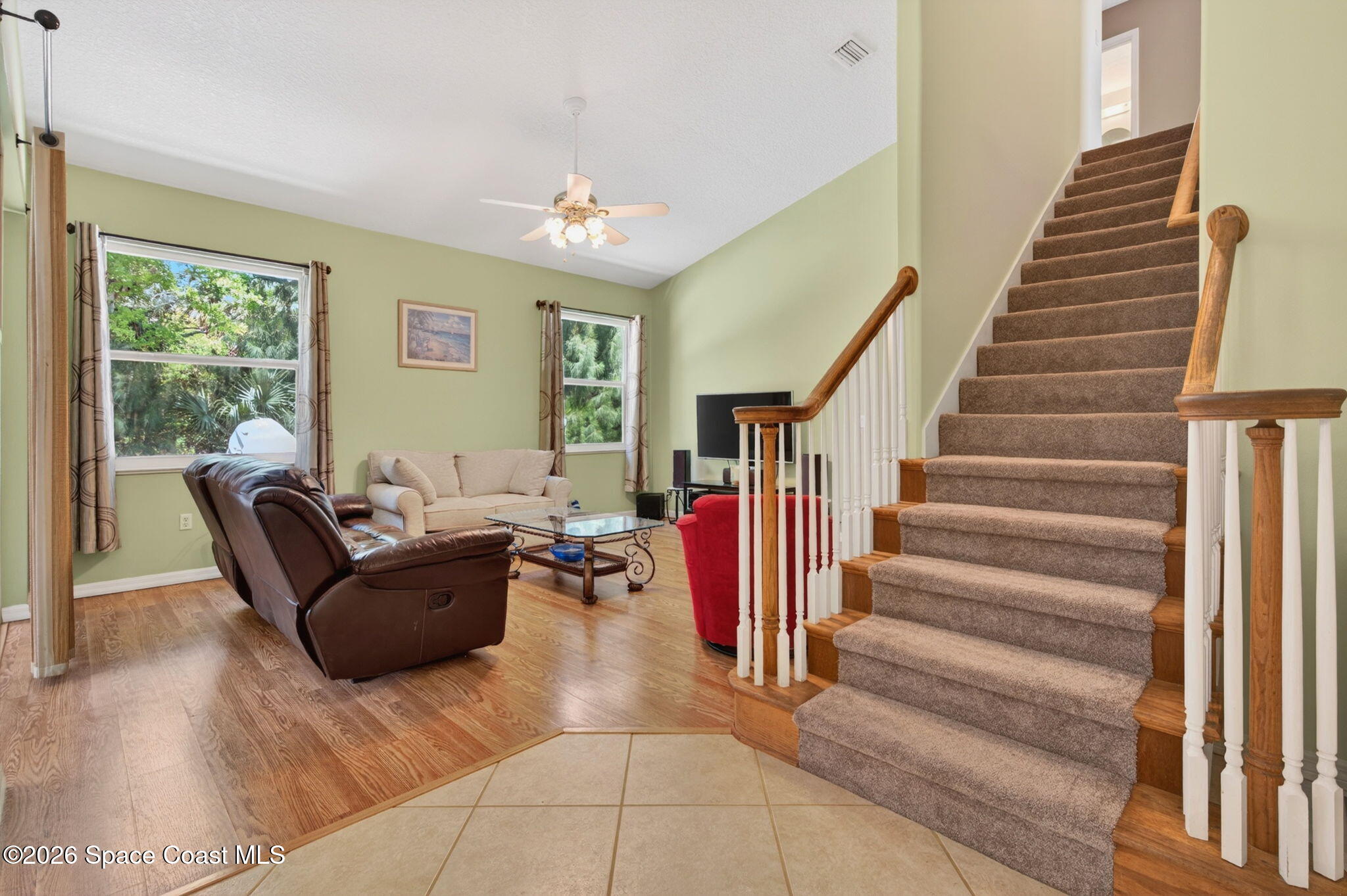 440 Mohawk Trail Merritt Island, FL 32953 - Photo 21 of 86 a living room with furniture and stairs