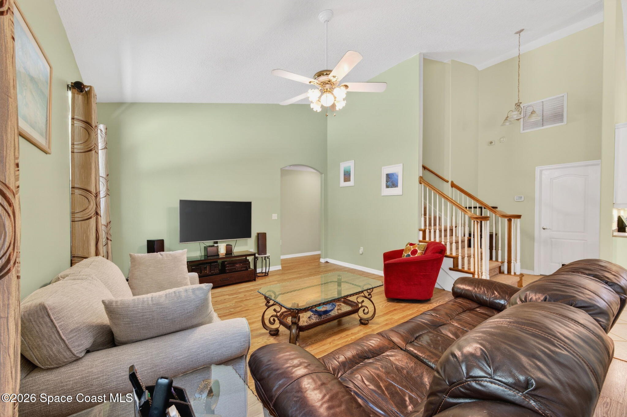 440 Mohawk Trail Merritt Island, FL 32953 - Photo 22 of 86 a living room with furniture and a flat screen tv