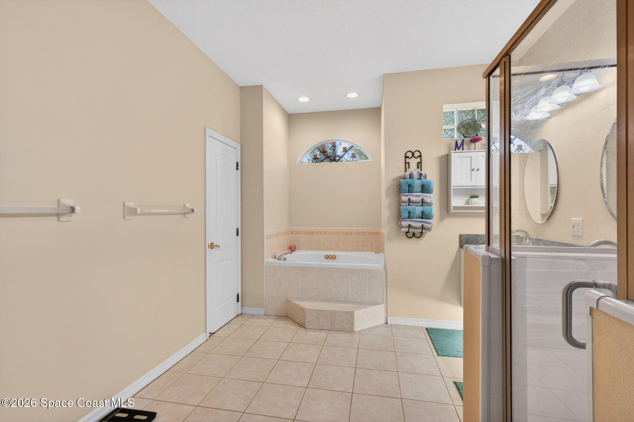 440 Mohawk Trail Merritt Island, FL 32953 - Photo 30 of 86 a bathroom with a bathtub and a shower