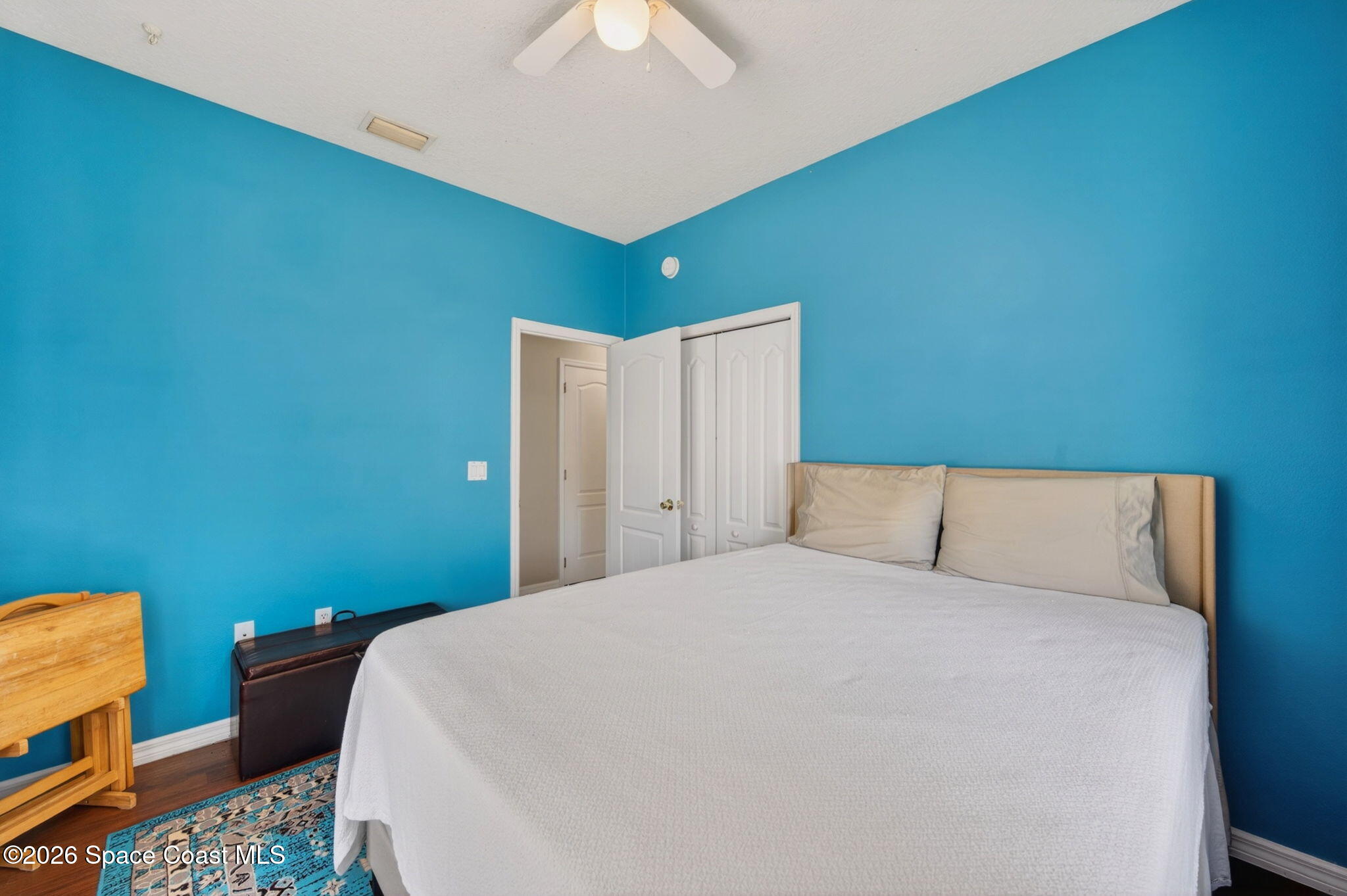 440 Mohawk Trail Merritt Island, FL 32953 - Photo 36 of 86 a large bed sitting in a bedroom next to a lamp